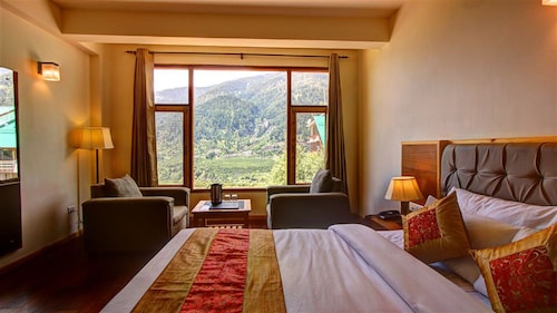The woodbine is situated amongst lofty evergreens and sublime peaks. - Spiti Valley